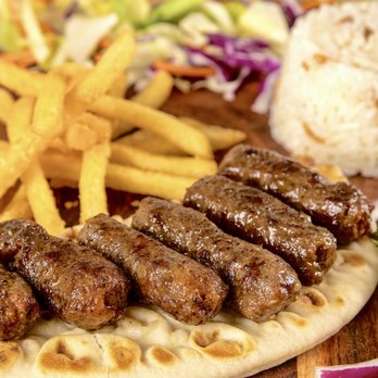 My Turkish Table - a plate of food with french fries and broccoli - Turkish Near Me - Oviedo, Florida