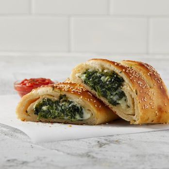 Sbarro - a close up of a sandwich with spinach and cheese - Pizza Near Me - TACOMA, Washington Sbarro - a close up of a sandwich with spinach and cheese - Pizza Near Me - TACOMA, Washington