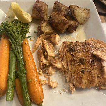 Johnny Rocco's Italian Grill - Salmon with seasonal veggies. I hate potatoes but these were so good, the spices were insane in them! - Italian Near Me - Niagara Falls, Ontario
