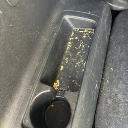 Unvacuumed cup holder in the back seat Unvacuumed cup holder in the back seat