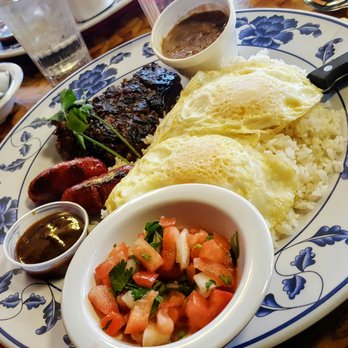 Uncle Mike's Place - Skirt steak and longanisa with garlic fried rice, eggs, tomatoes, champorado, and unnecessary (but good) steak sauce. - Breakfast & Brunch Near Me - Chicago, Illinois Uncle Mike's Place - Skirt steak and longanisa with garlic fried rice, eggs, tomatoes, champorado, and unnecessary (but good) steak sauce. - Breakfast & Brunch Near Me - Chicago, Illinois