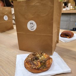 Ham and cheese in the back za'atar bun in the front Ham and cheese in the back za'atar bun in the front
