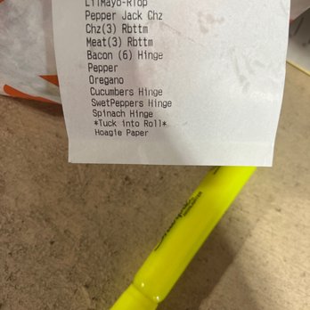 Wawa - a receipt on a table with a yellow pen - Convenience Stores Near Me - Royersford, Pennsylvania
