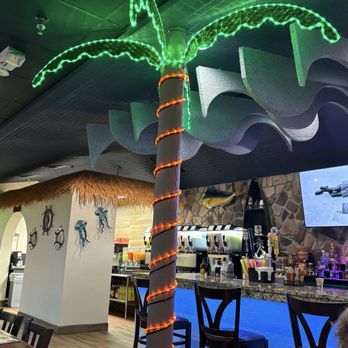 Vallarta Mexican & Seafood - Post turned into Palm tree, super cute... and slushies in the background. - Mexican Near Me - Dayton, Ohio