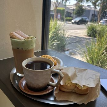 Kissa by Motto - Garlic toast and savory scone with their latte w matcha foam sprinkled w pistachio! - Cafes Near Me - Pasadena, California Kissa by Motto - Garlic toast and savory scone with their latte w matcha foam sprinkled w pistachio! - Cafes Near Me - Pasadena, California