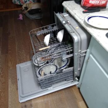 Emerald Isle Realty  - Dishwasher fell out when trying to load and was full of dirty dishes upon arrival - Property Management Near Me - Emerald Isle, North Carolina