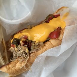 Pulled pork with onions, peppers, and cheese