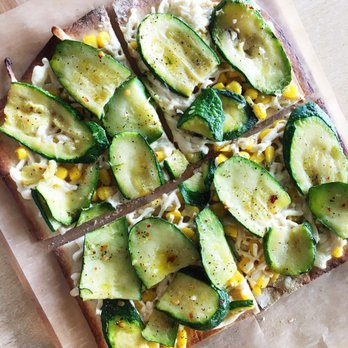 Jules Thin Crust - Veggie #7 made with Daiya. Shows 2 slices which is the required minimum for custom pies. - Pizza Near Me - Jenkintown, Pennsylvania