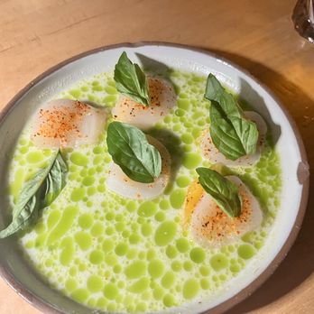 Nomade - Scallop dish with this amazing coconut broth that we actually held on to and ate with other things because it was so good - Mexican Near Me - Austin, Texas