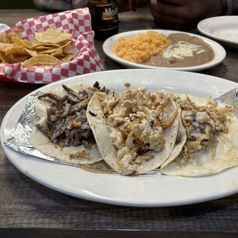 Chukis Tacos 2 - Chicken and Beef tocos with a side of beans and rice. - Mexican Near Me - Memphis, Tennessee Chukis Tacos 2 - Chicken and Beef tocos with a side of beans and rice. - Mexican Near Me - Memphis, Tennessee
