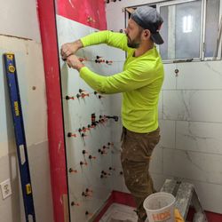 Tavares Associates Construction - Taking care of some tiling in a relatively smaller bathroom