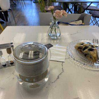 Classics Cafe & Flower Shop - Single serving of happy tea brewing and blue berry scone - Florists Near Me - Cypress, California Classics Cafe & Flower Shop - Single serving of happy tea brewing and blue berry scone - Florists Near Me - Cypress, California