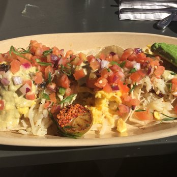 Snooze, an A.M. Eatery - Breakfast tacos with added avocado, grilled onions and garlic - Breakfast & Brunch Near Me - Tempe, Arizona Snooze, an A.M. Eatery - Breakfast tacos with added avocado, grilled onions and garlic - Breakfast & Brunch Near Me - Tempe, Arizona
