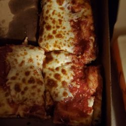 Cheese falling off pizza and can't even cut it right