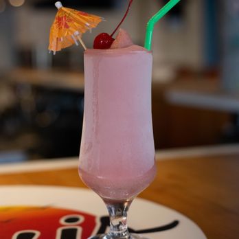 The Oasis Naples - a pink drink with an umbrella - American Near Me - Naples, Florida The Oasis Naples - a pink drink with an umbrella - American Near Me - Naples, Florida