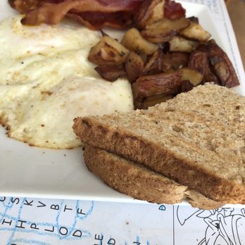 Old Captiva House - Two Eggs, Bacon, Breakfast Potatoes and toast - New American Near Me - Captiva, Florida Old Captiva House - Two Eggs, Bacon, Breakfast Potatoes and toast - New American Near Me - Captiva, Florida