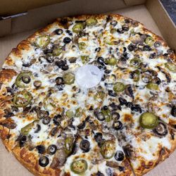Roman's Pizza - White Sauce Mushrooms black olives and jalapeño. Quality ingredients