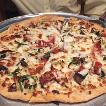 Crowbar & Grill - Small veggie pizza- enough for two people. Olive Oil and herbs as the sauce, leeks, spinach, mushrooms and red peppers - Burgers Near Me - Laramie, Wyoming