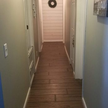All Trade Construction - a long hallway with a wreath on the wall - General Contractors Near Me All Trade Construction - a long hallway with a wreath on the wall - General Contractors Near Me