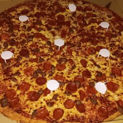 Big T's Pizza - Body Slammer cut into big slices