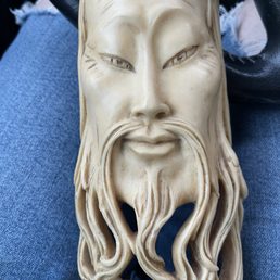 Carved ivory-look asian statue. $8.