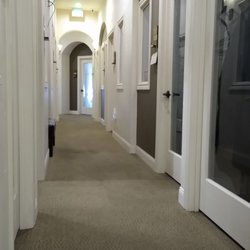 Fabulous Faces - Long hallway with carpet that's vacuumed.