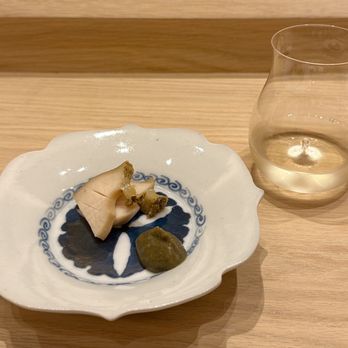 Icca - Steamed Nagasaki abalone with seaweed (kombu). The paired sake was served in a particularly elegant glass. - Japanese Near Me - New York, New York