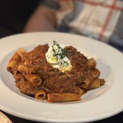 Martin's Italian - Bolognese Red wine braised beef and pork, herbs, tomato, herbed ricotta, rigatoni mezzi pasta