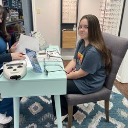 Collierville Vision Center - Kid getting sized up for some new specs