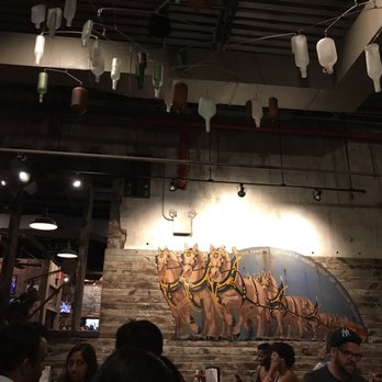 Dinosaur Bar-B-Que - A nice turning chandelier and a nice industrial accent all over the place - Barbeque Near Me - Brooklyn, New York