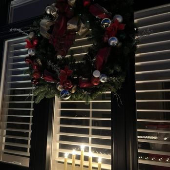Haus Interiors - Window wreath at night - Interior Design Near Me