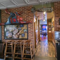Macado's - The entrance hallway to the restrooms and the game room in the background.