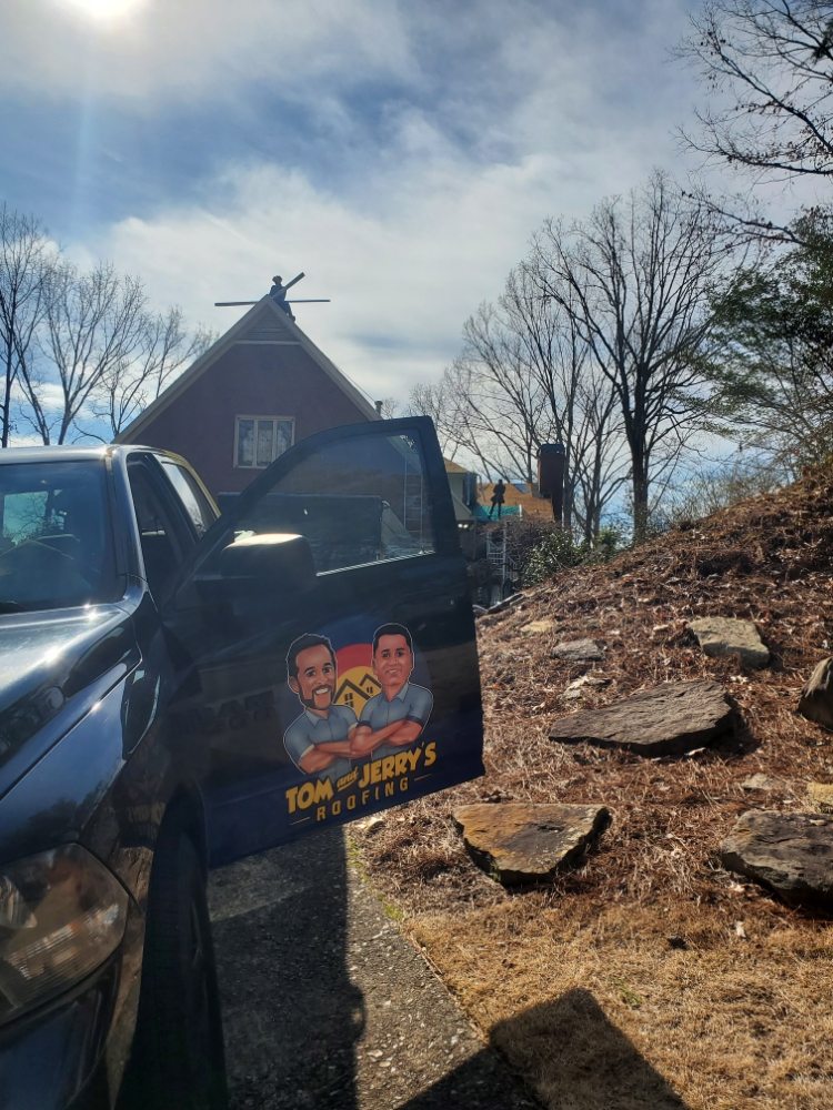 Slide of Tom and Jerry's Roofing