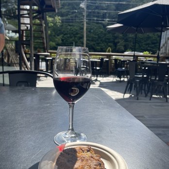 Old Orchard Creek General Store - Outside sitting area with wine and sweets - Wine Bars Near Me - Lansing, North Carolina Old Orchard Creek General Store - Outside sitting area with wine and sweets - Wine Bars Near Me - Lansing, North Carolina