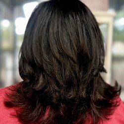 Crowning Glory Hair Studio - Layered & Texturized Haircut with a blowout on extremely course, frizzy, & curly hair. Created by Miranda.