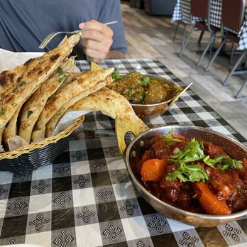 Darshan Restaurant & Bar - Garlic naan, curried goat at back. Forgot name of food in foreground - Indian Near Me - Reynoldsburg, Ohio Darshan Restaurant & Bar - Garlic naan, curried goat at back. Forgot name of food in foreground - Indian Near Me - Reynoldsburg, Ohio