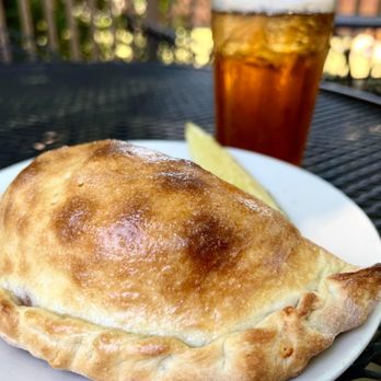 High Street Pizza - a pie with a slice of lemon on a plate - Pizza Near Me - Antlers, Oklahoma High Street Pizza - a pie with a slice of lemon on a plate - Pizza Near Me - Antlers, Oklahoma