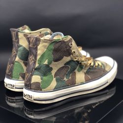 Custom Converse Chucks! Canvas camo, denim and authentic Louis Vuitton paneling with metallic gold leather laces detail.
