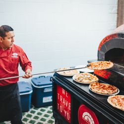 Chef Danny hard at work making some of the pest wood fired pizza you can get.