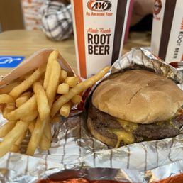 Double Cheeseburger with fries and a drink.