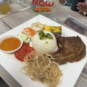 Vietnow - Vietnamese traditional rice plate with pork chop, pork skin and I believe a Vietnamese meatloaf. - Vietnamese Near Me - Santa Rosa, California Vietnow - Vietnamese traditional rice plate with pork chop, pork skin and I believe a Vietnamese meatloaf. - Vietnamese Near Me - Santa Rosa, California