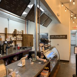 Frank & Joe’s Coffee House - Hospital District - Ordering area with displays for food and scene of working area.