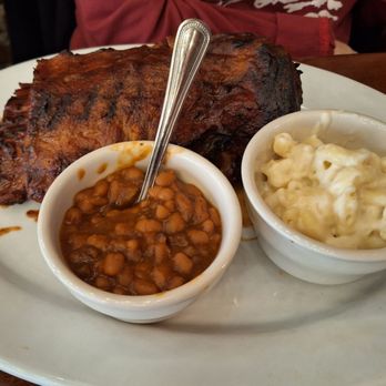 Darryl's Wood Fired Grill - Rack of baby back ribs with baked beans and mac n cheese. - New American Near Me - Greensboro, North Carolina