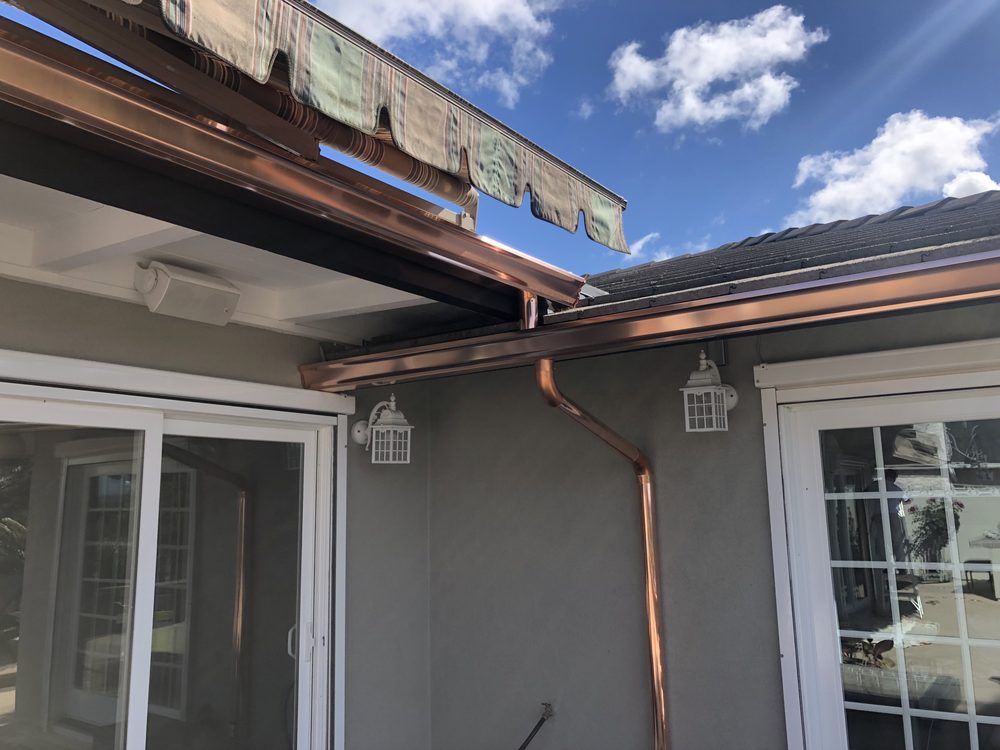 Slide of Escamilla’s Roofing and Rain Gutters