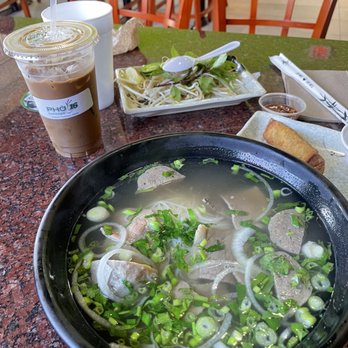 Pho 16 Express - Iced Vietnamese Coffee and P7 - Steak-brisket -meatball Pho and chicken egg rolls. - Vietnamese Near Me - Orlando, Florida Pho 16 Express - Iced Vietnamese Coffee and P7 - Steak-brisket -meatball Pho and chicken egg rolls. - Vietnamese Near Me - Orlando, Florida