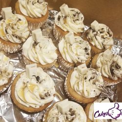 Cakes Like Velvet - White Chocolate Cupcakes w/ caramel drizzle and Oreo crumbs