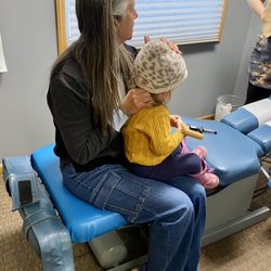 Levinson Family Chiropractic - Dr. Pam adjusting an infant