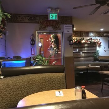 China Palace Restaurant - Tables and decor-including holiday decorations. There was a beautiful wreath on the way in but my photo was very blurry! - Chinese Near Me - El Centro, California China Palace Restaurant - Tables and decor-including holiday decorations. There was a beautiful wreath on the way in but my photo was very blurry! - Chinese Near Me - El Centro, California