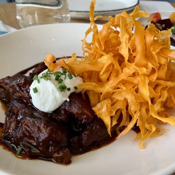 Zhug - Saffron and Date Braised Lamb - Mediterranean Near Me - Cleveland Heights, Ohio Zhug - Saffron and Date Braised Lamb - Mediterranean Near Me - Cleveland Heights, Ohio