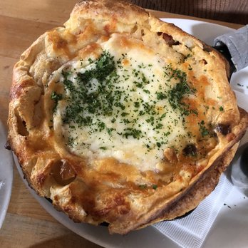 Tilikum Place Cafe - Savory Dutch baby -pancetta, onions, tomatoes, cheese - New American Near Me - Seattle, Washington